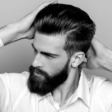 black and white photo of man combing hair