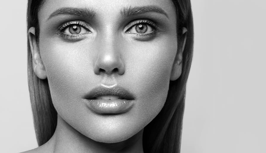 black and white photo of woman staring