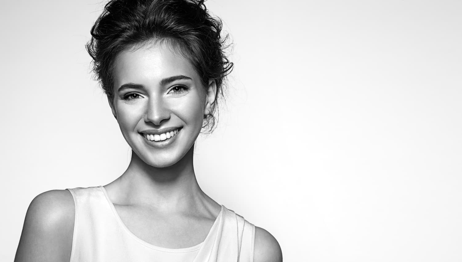 woman with short hair smiling