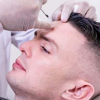 Man undergoing a facial dermal filler procedure