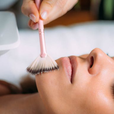 Woman undergoing a chemical peel procedure